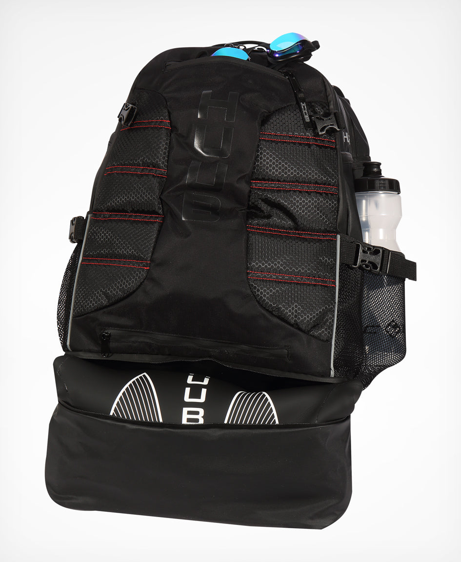 HUUB TT Bag – Transition Three, 40L rucksack, wet/dry, hidden helmet cradle, navy and olive/orange.
